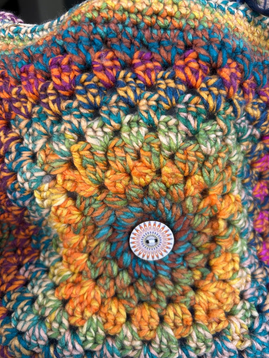 Colourful crochet detail with decorative button