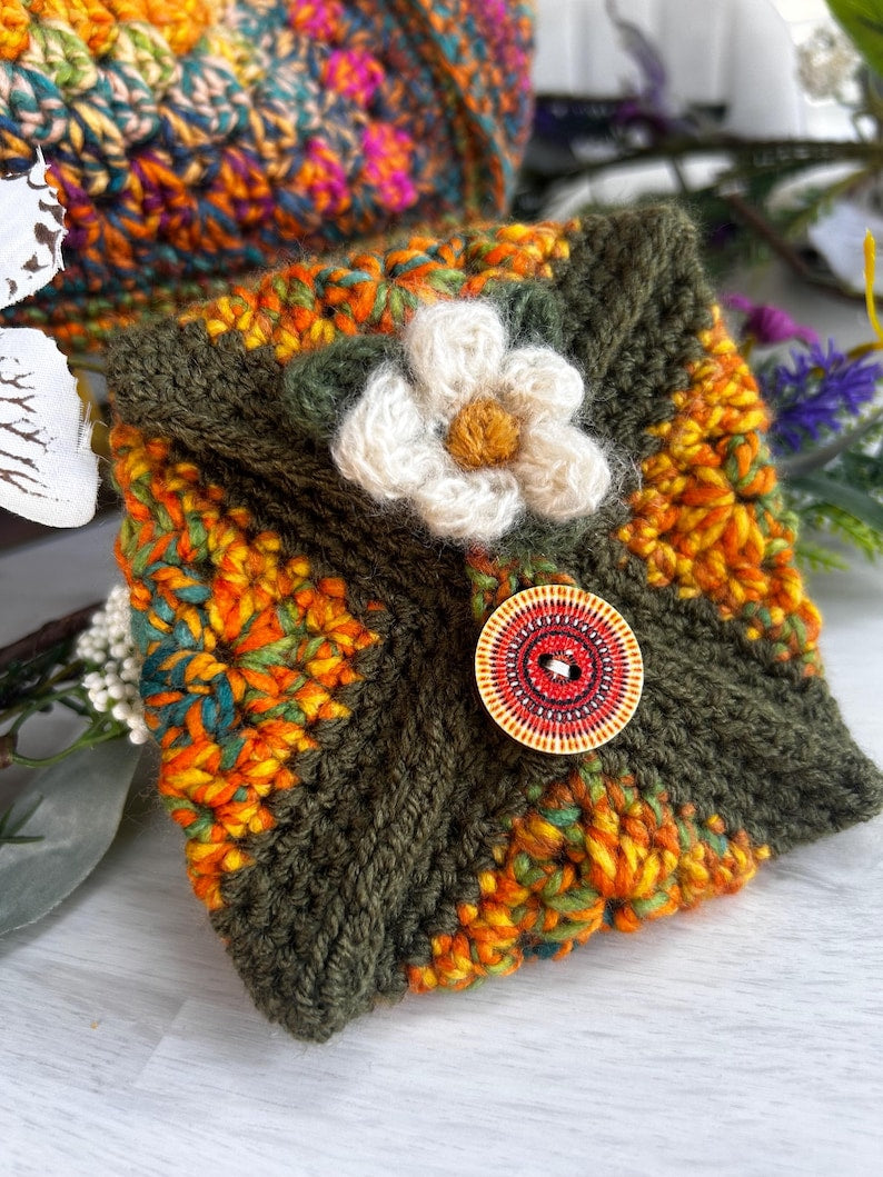 Crochet pouch in olive, orange and yellow with flower