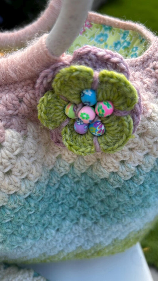 Pastel crochet handbag with olive flower embellishment