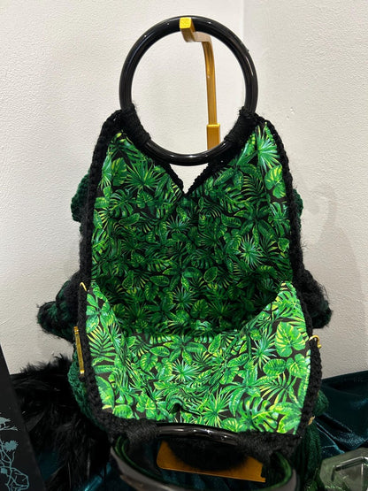 Crochet handbag interior with green tropical leaf lining