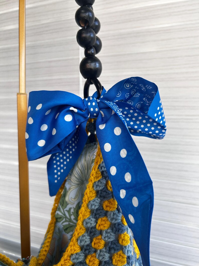 Detail of the blue and yellow crochet squares