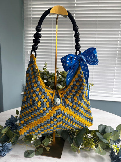 Beaded handle and blue polka dot ribbon detail