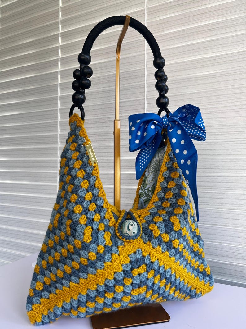 Blue and yellow crochet granny-square festival handbag