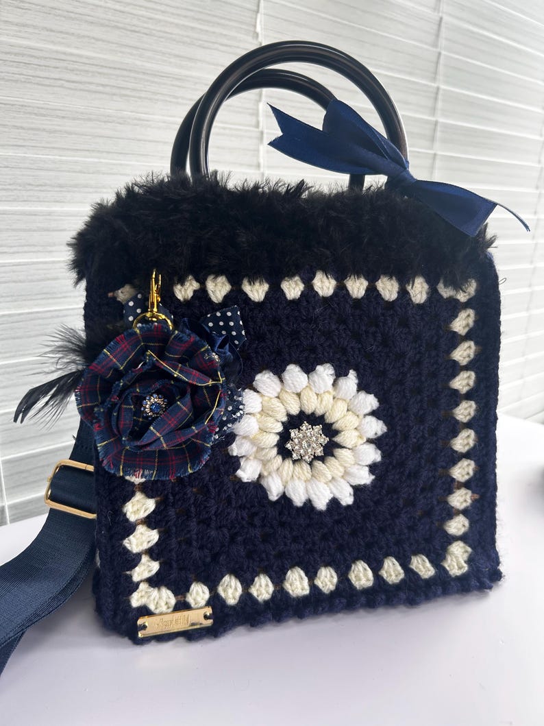 Cream and navy crochet tote with tartan flower brooch