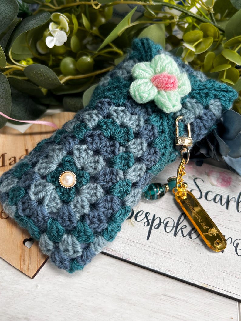 Teal crochet case with mint and pink flower