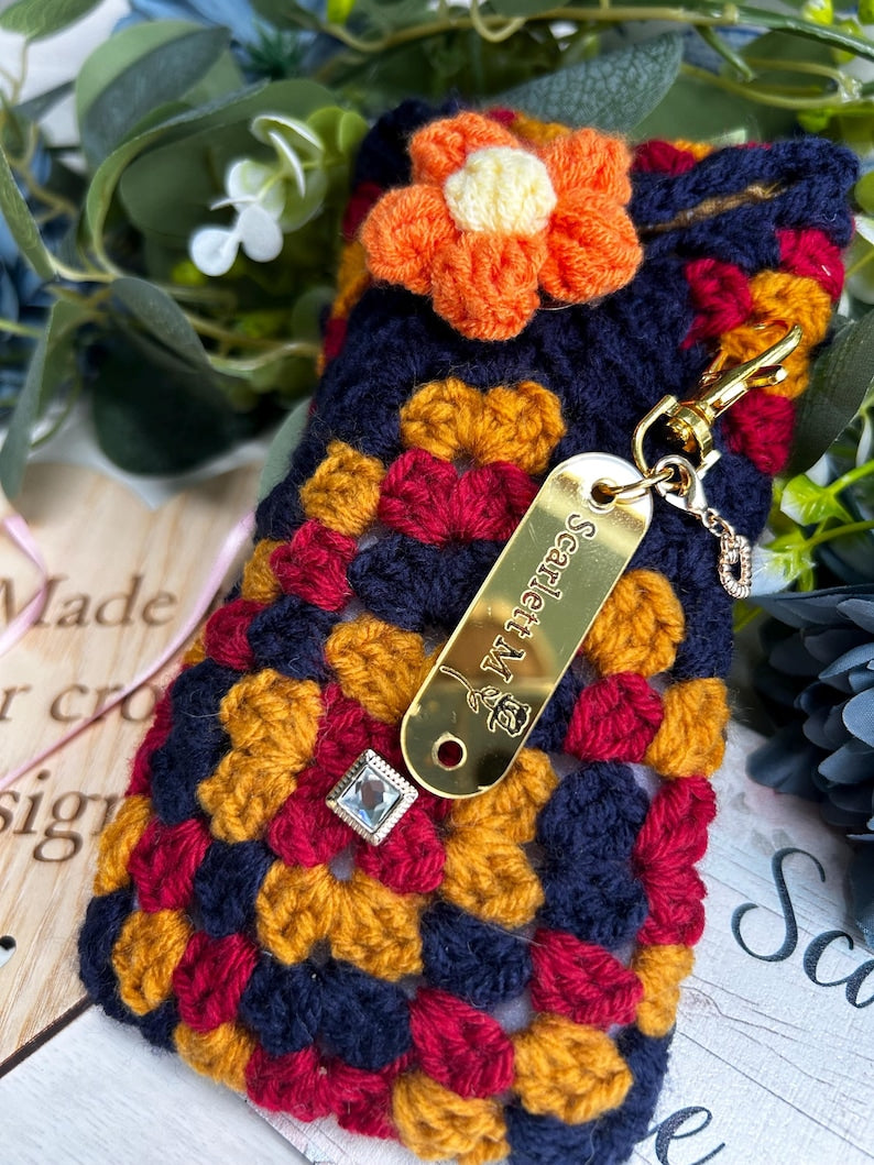 Navy and red crochet case with orange flower
