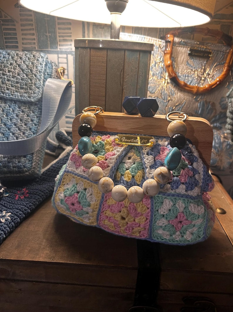 Pastel crochet handbag with beaded handle detail