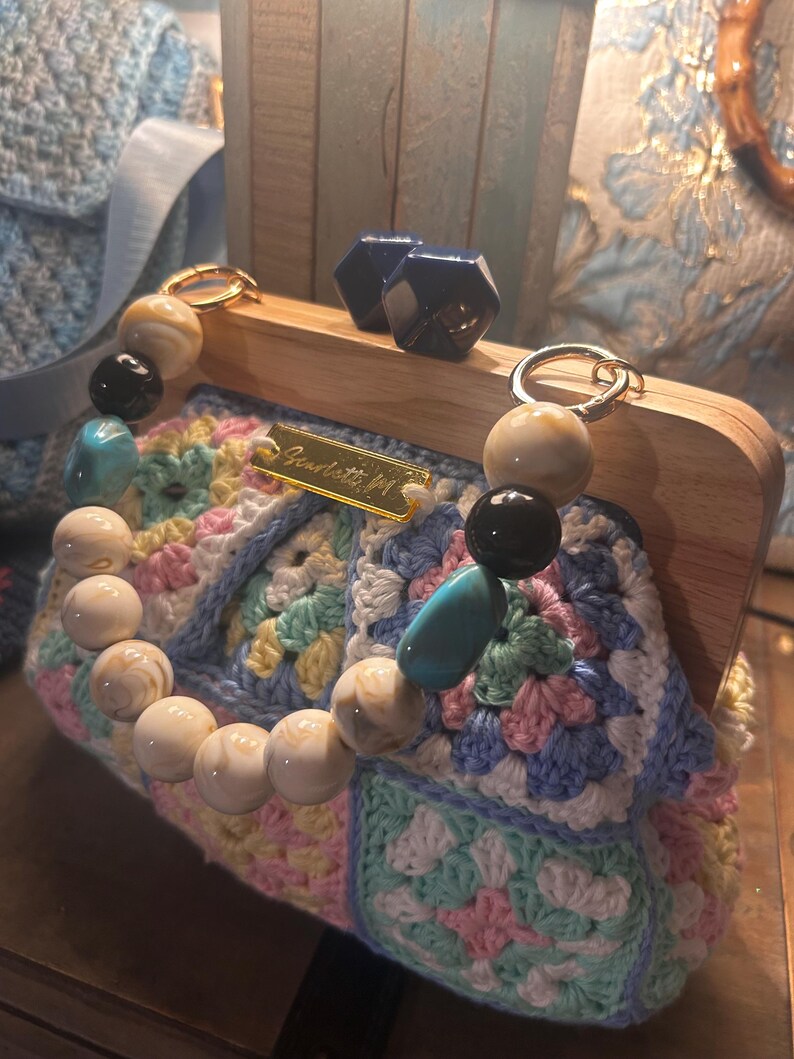 Pastel crochet purse with wooden frame, full view