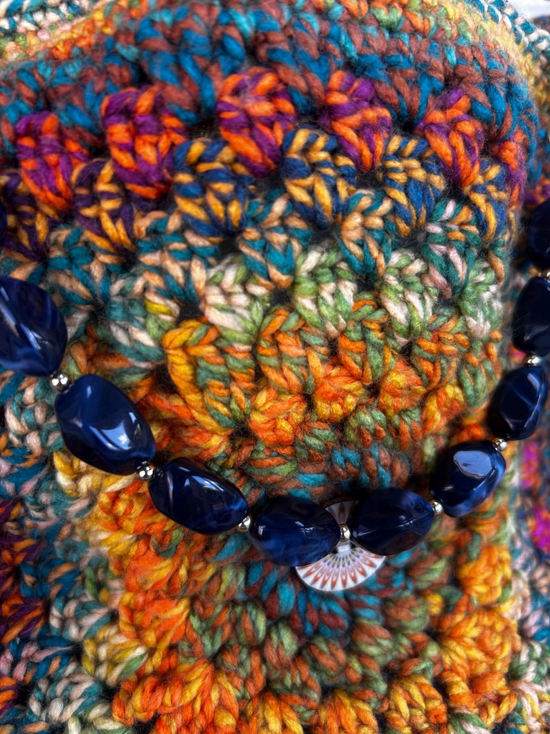 Dark blue beaded strap detail on crochet bag