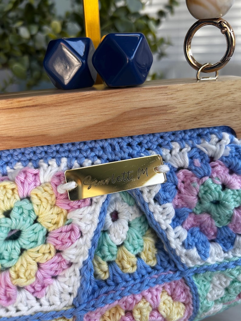 Pastel granny square clutch with Scarlett M tag
