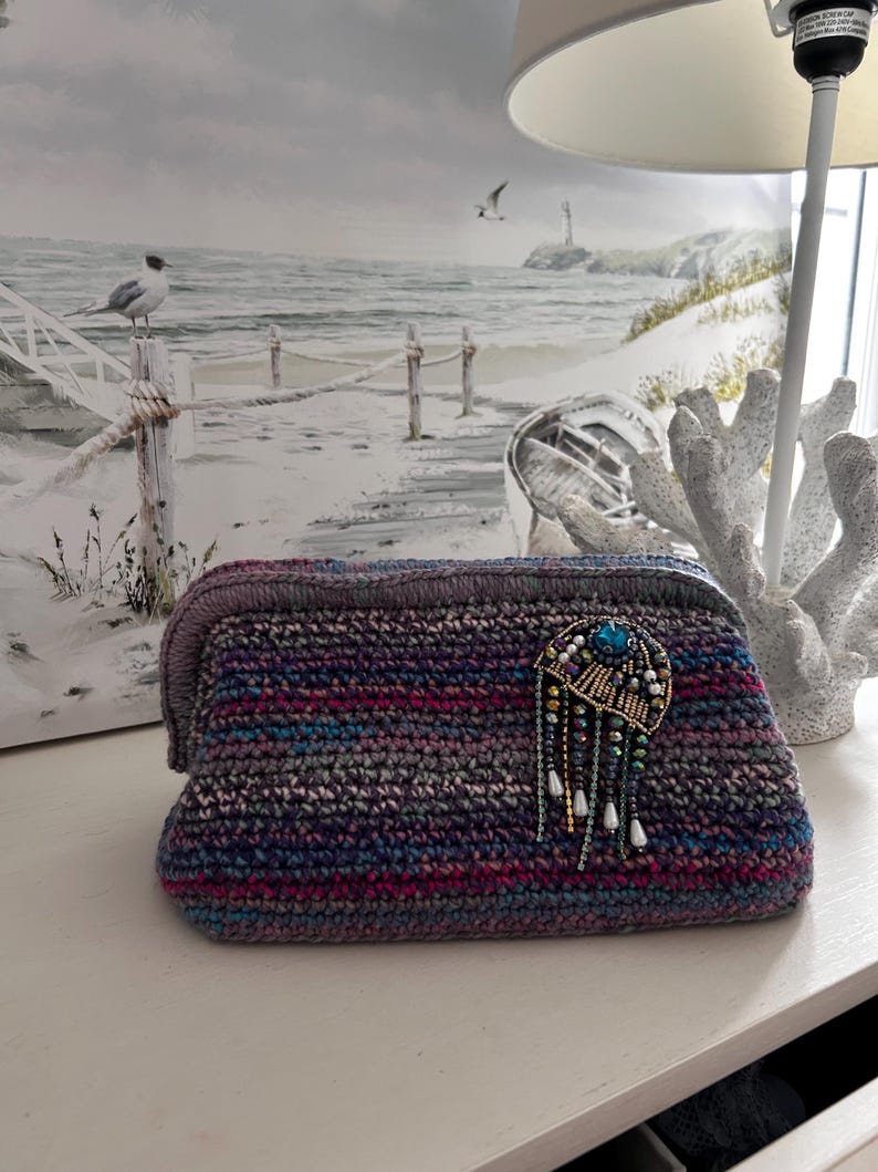 Crochet clutch with turquoise stone and dangling beads