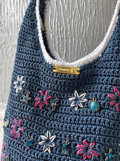 Blue crochet handbag with mermaid and seashell charms