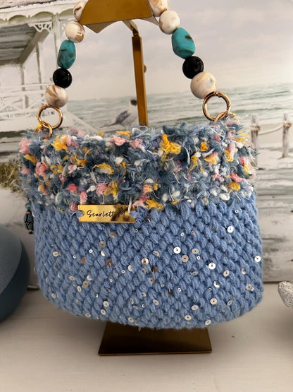 Light blue crochet bag with fringe top and Scarlett M metal tag