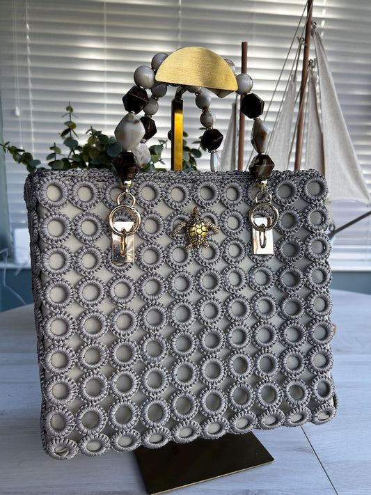 Gray crochet statement tote with pearl bead handles and gold turtle charm