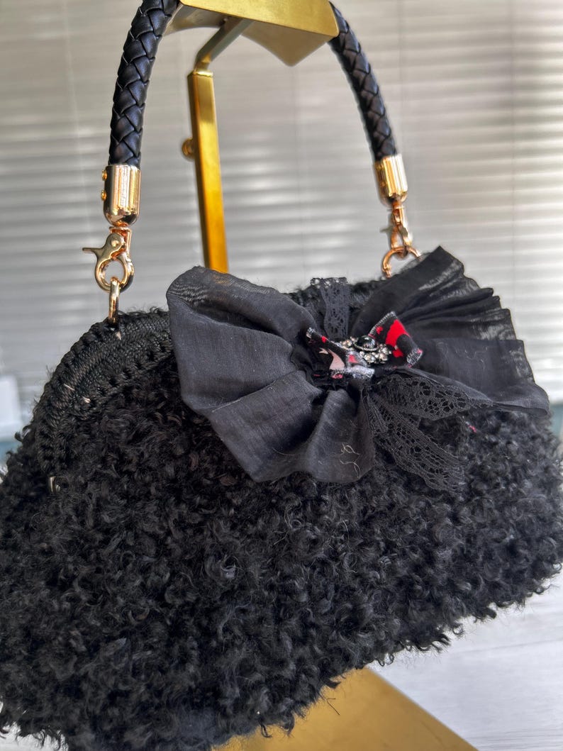 Black bag with sheer lace bow and crystal accent