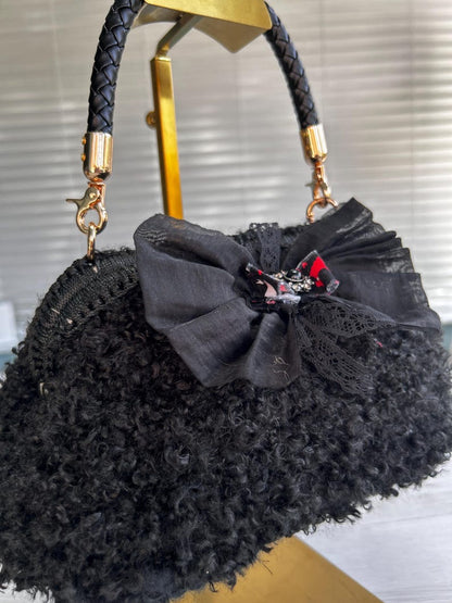 Black bag with sheer lace bow and crystal accent