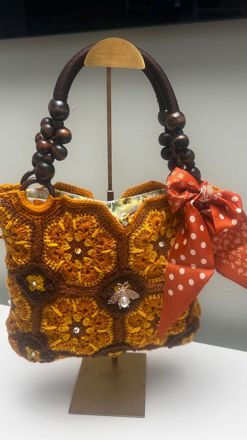 Crochet tote with bee embellishment and polka-dot scarf
