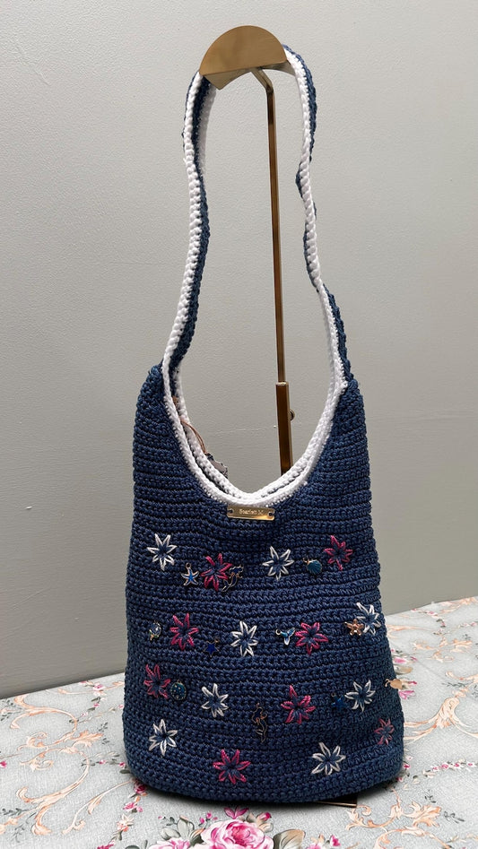 Dark blue crochet shoulder bag with floral charms and Scarlett M tag