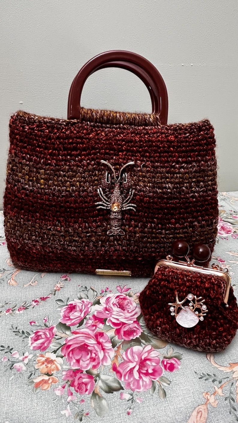 Brown and copper crochet handbag with lobster embellishment and matching coin purse