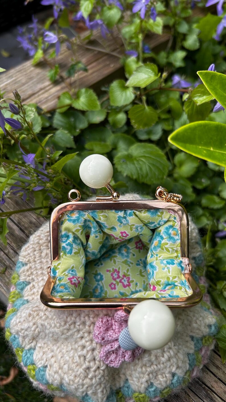 Crochet coin purse with floral fabric lining