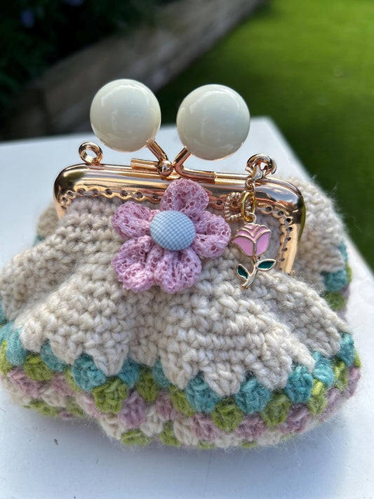 Cream crochet coin purse with pastel border and rose charm