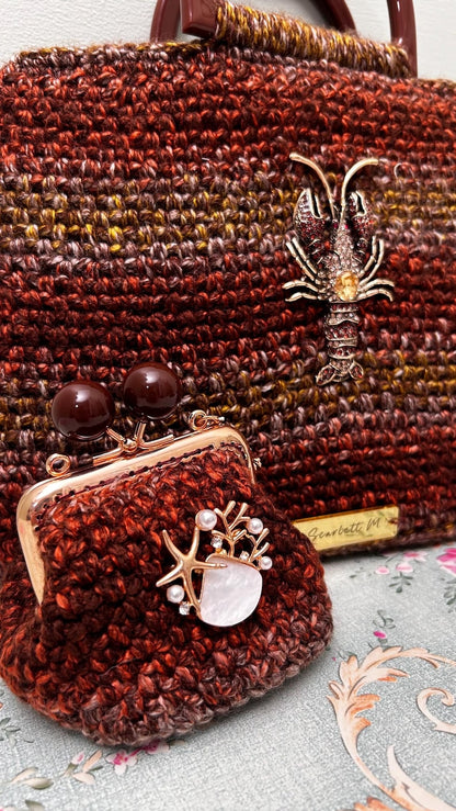 Crochet handbag and coin purse with starfish and shell embellishment